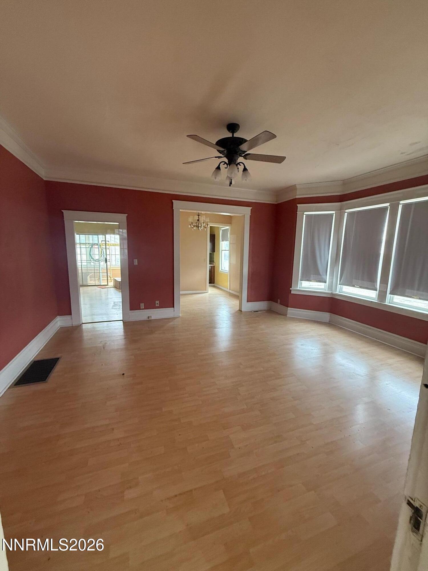 2421 Harrigan Road Fallon, NV 89406 - Photo 9 of 17 a view of an empty room with window and wooden floor