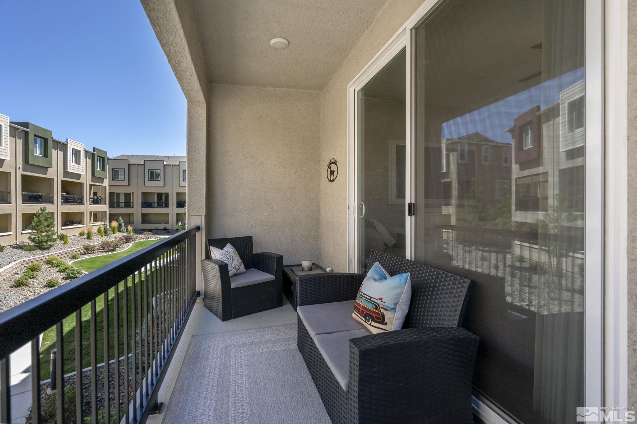 3214 Sterling Ridge Circle Sparks, NV 89431 - Photo 16 of 19 a balcony with furniture and view of city