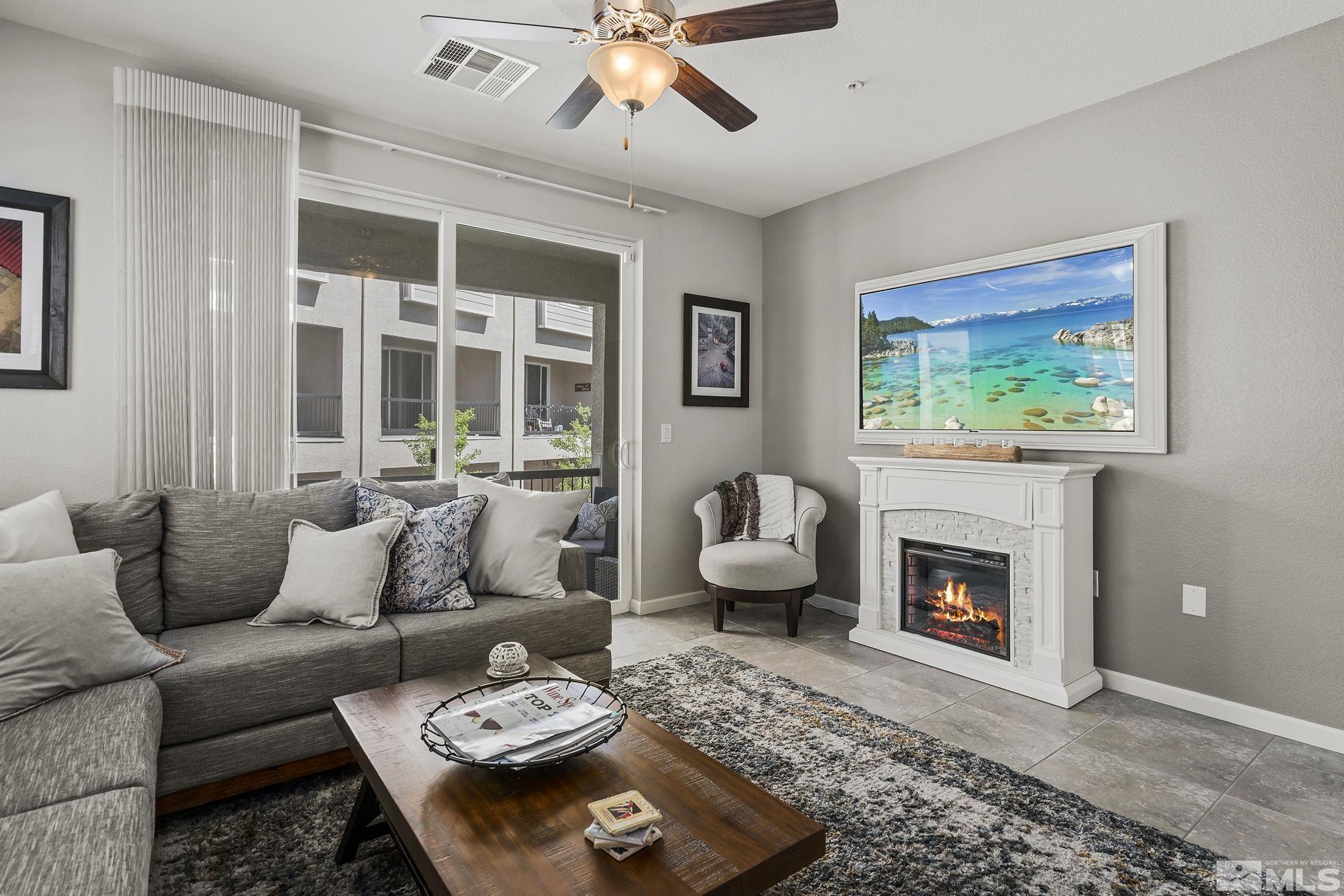 3214 Sterling Ridge Circle Sparks, NV 89431 - Photo 3 of 19 a living room with furniture and a fireplace