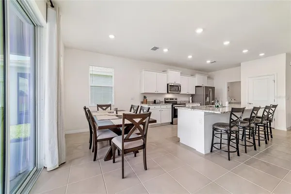 a view of a dining room kitchen and a window