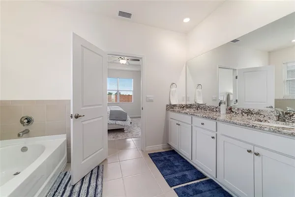 a bathroom with a bathtub and shower