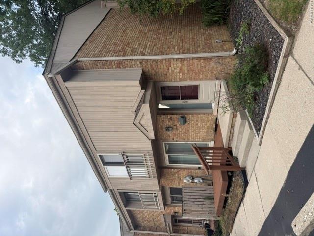 629 Oakbrook West, Unit 18 Rochester, MI 48307 - Photo 10 of 18 Brick and vertical siding exterior with an elevated entrance
