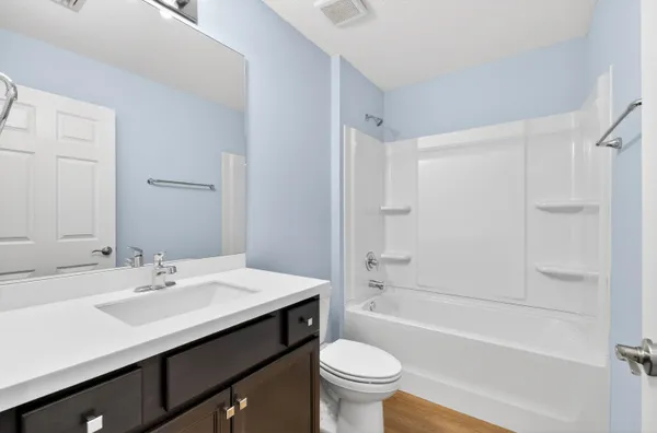 a bathroom with a sink a toilet and a bathtub