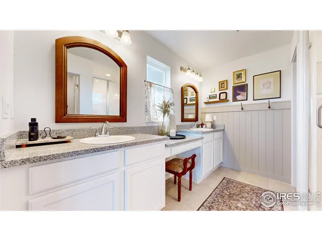a bathroom with a sink a vanity and a mirror