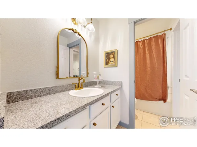 a bathroom with a sink a mirror and a shower