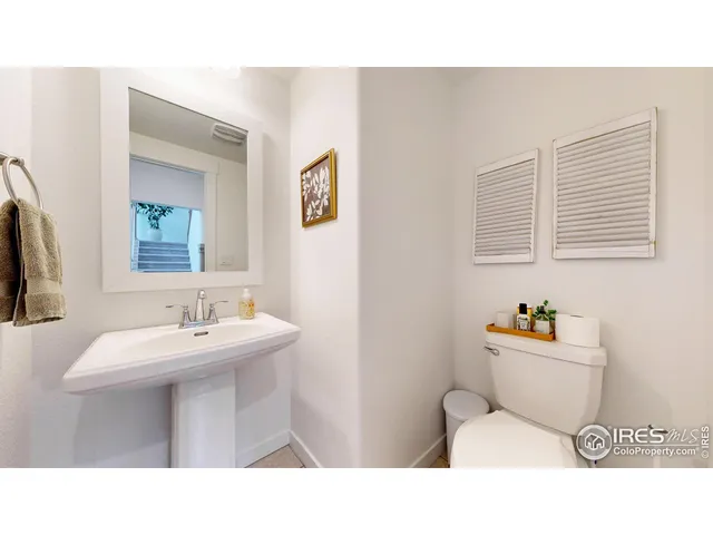 a bathroom with a sink mirror and a bathtub