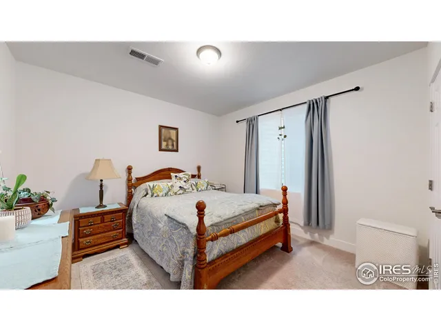 a living room with furniture and a lamp