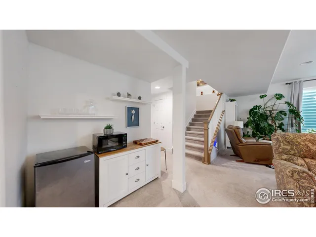 a kitchen with a sink and white cabinets