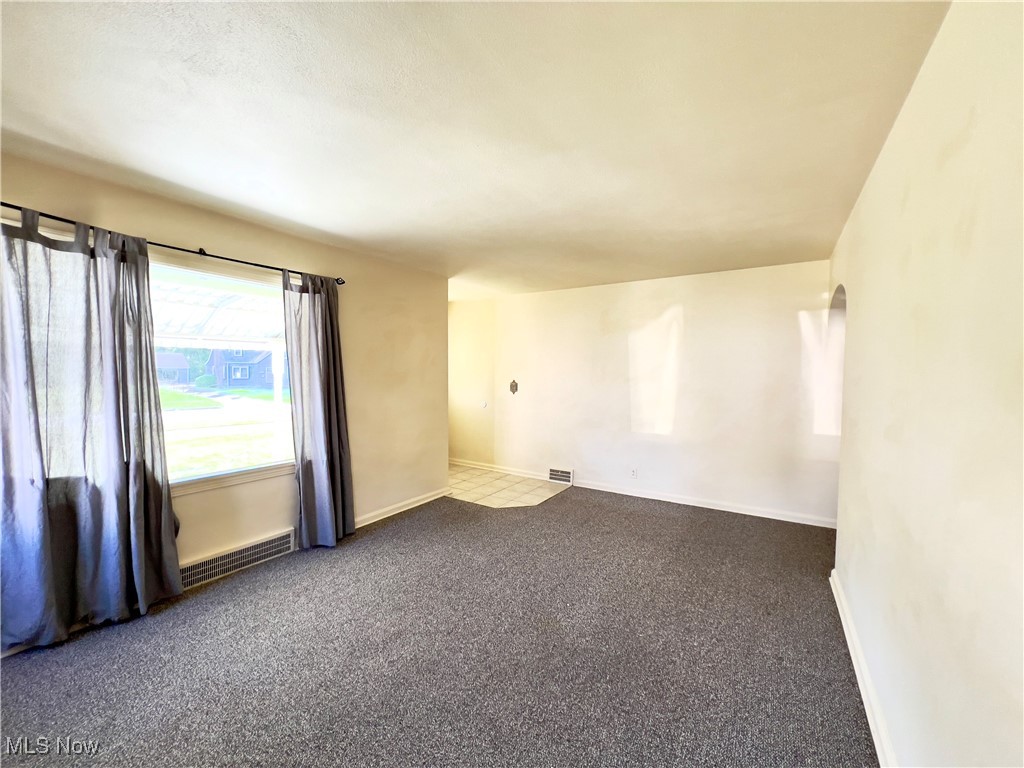 2024 Kirk Road Youngstown, OH 44511 - Photo 9 of 36 Spare room featuring carpet floors