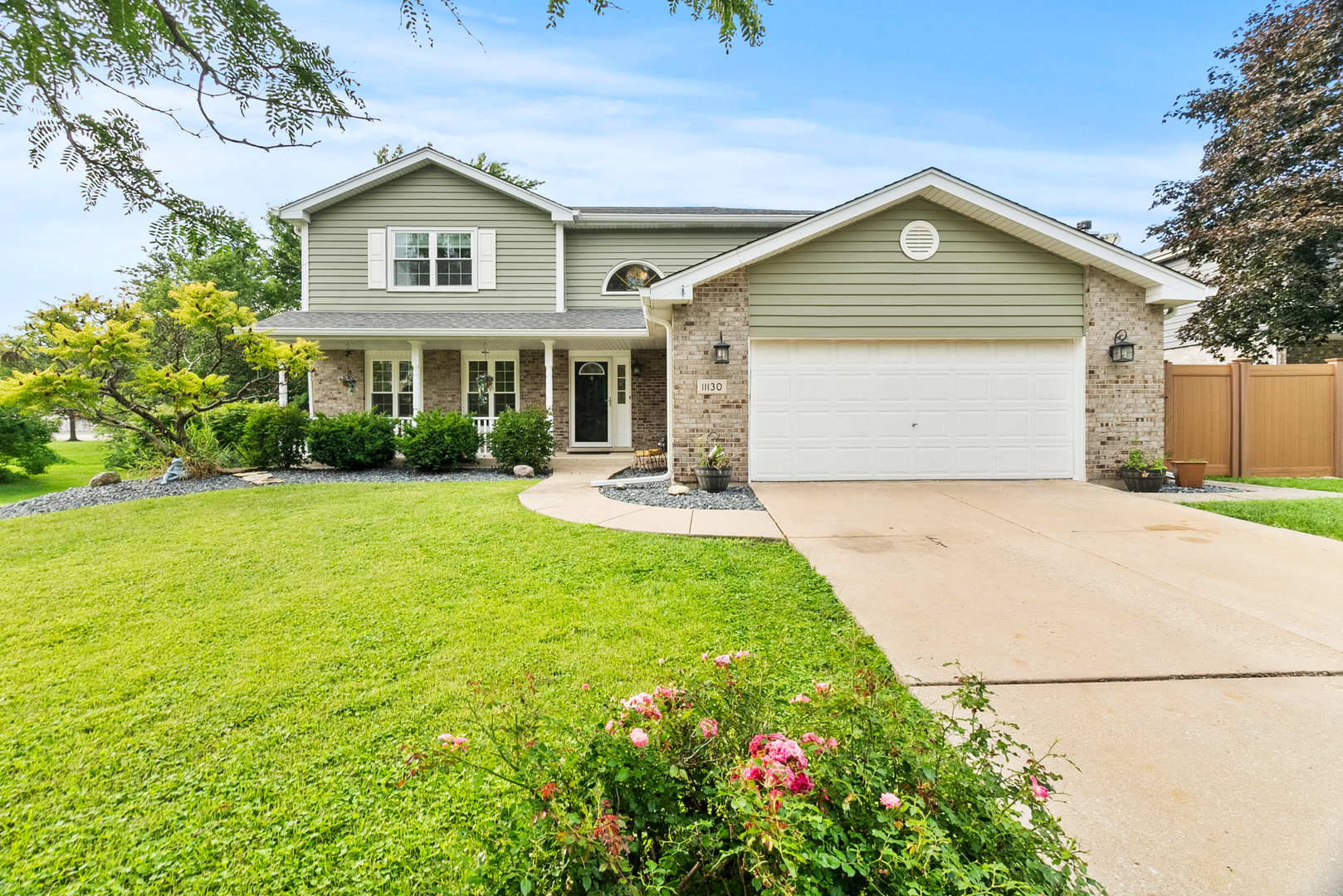 11130 Granite Drive Mokena, IL 60448 - Photo 1 of 41 a front view of a house with a yard and garage