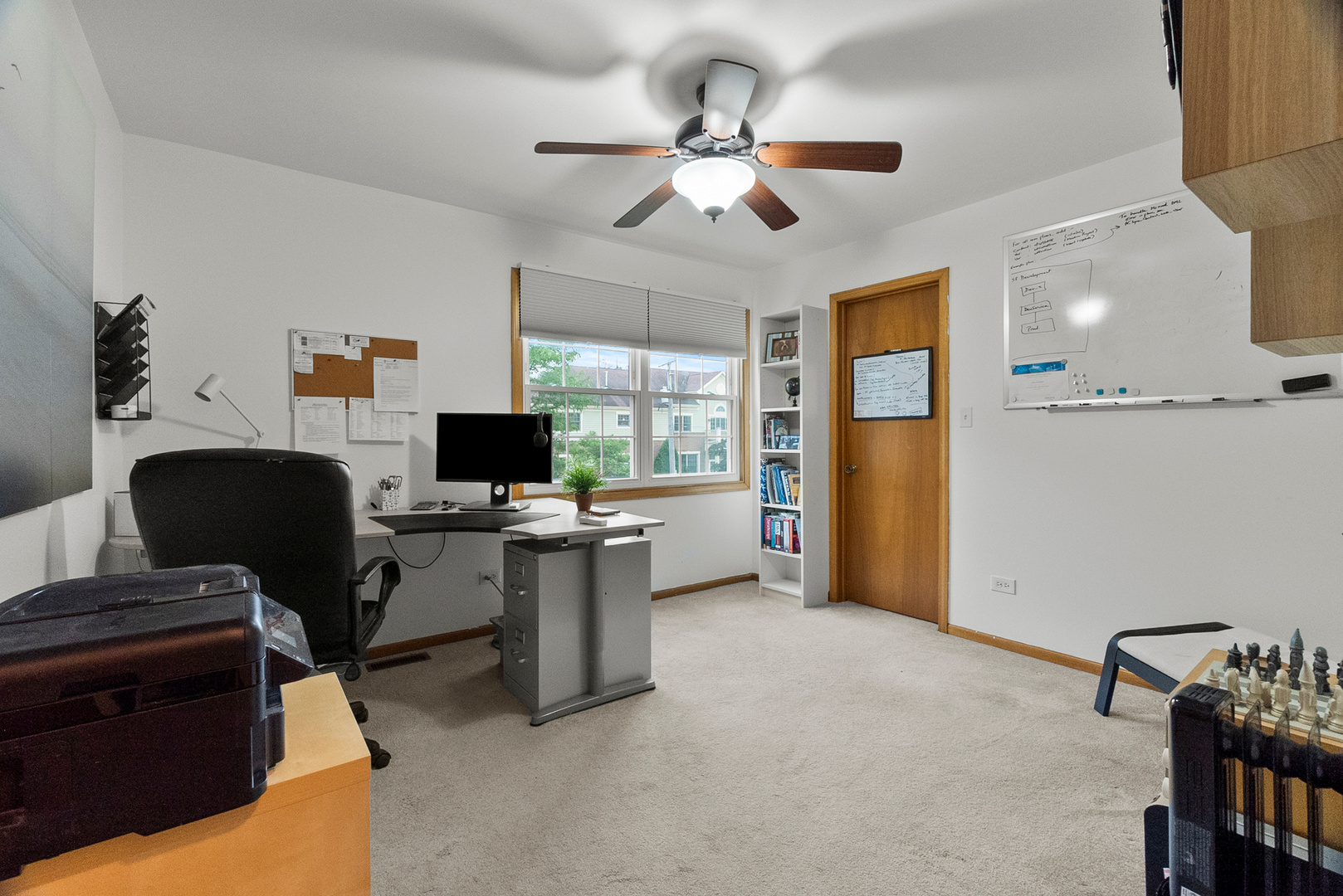 11130 Granite Drive Mokena, IL 60448 - Photo 22 of 41 a view of a workspace with furniture and a window