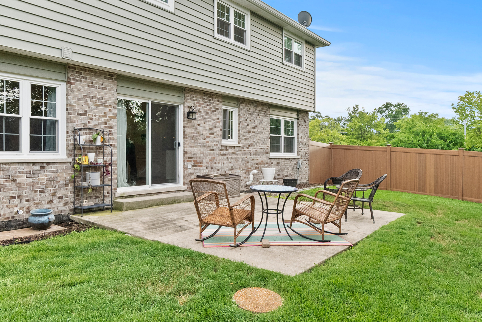11130 Granite Drive Mokena, IL 60448 - Photo 26 of 41 a view of a chair and table in backyard of the house