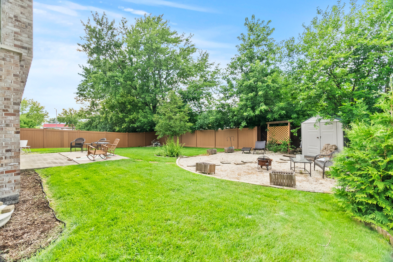 11130 Granite Drive Mokena, IL 60448 - Photo 29 of 41 a backyard of a house with table and chairs