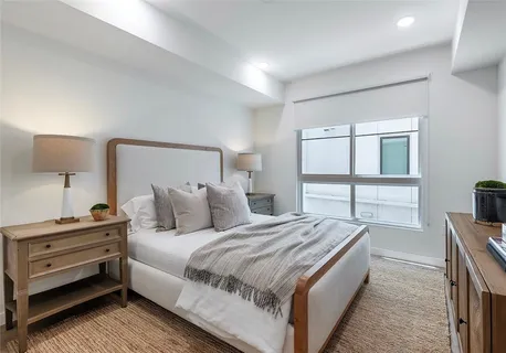 a bedroom with a bed and a dresser