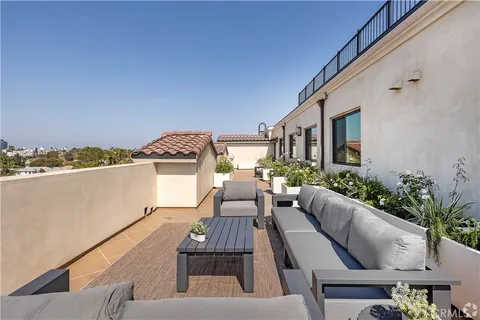 a view of a balcony with furniture