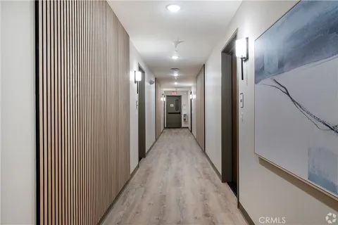 a view of hallway with a hallway and wooden floor