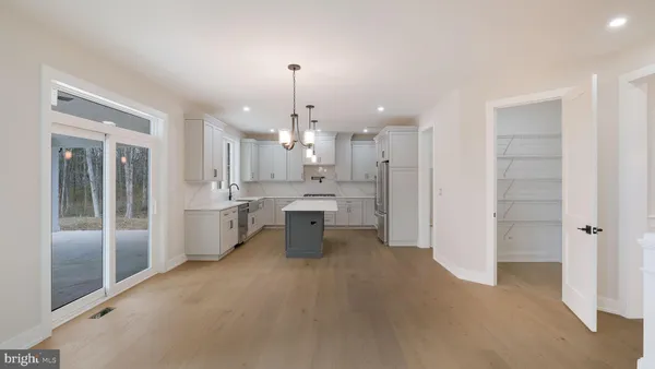 a view of an entryway with wooden floor