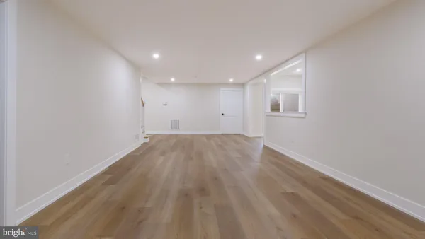 a view of an empty room with windows