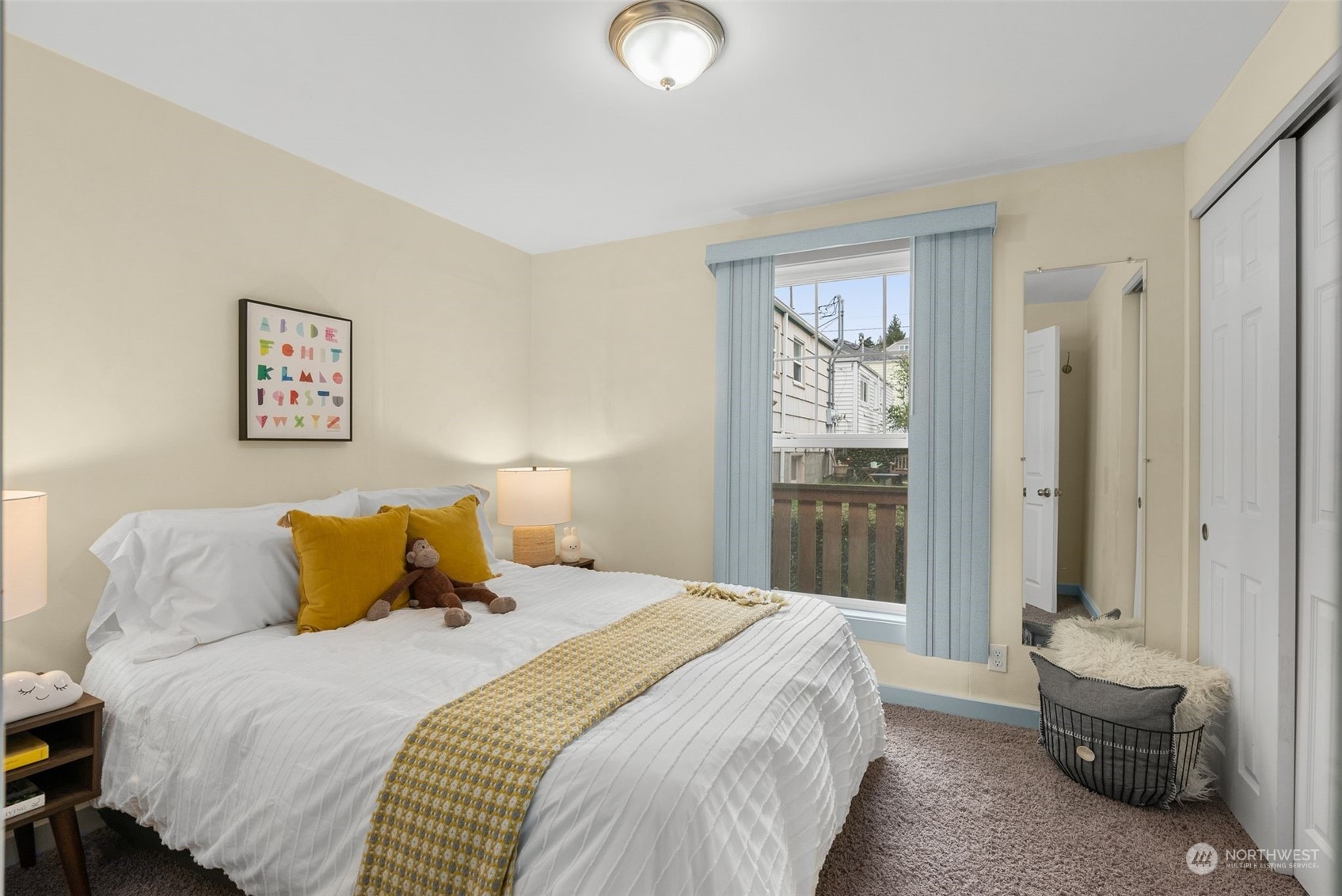 5915 Southwest Admiral Way Seattle, WA 98116 - Photo 20 of 31 a bedroom with a bed and a lamp