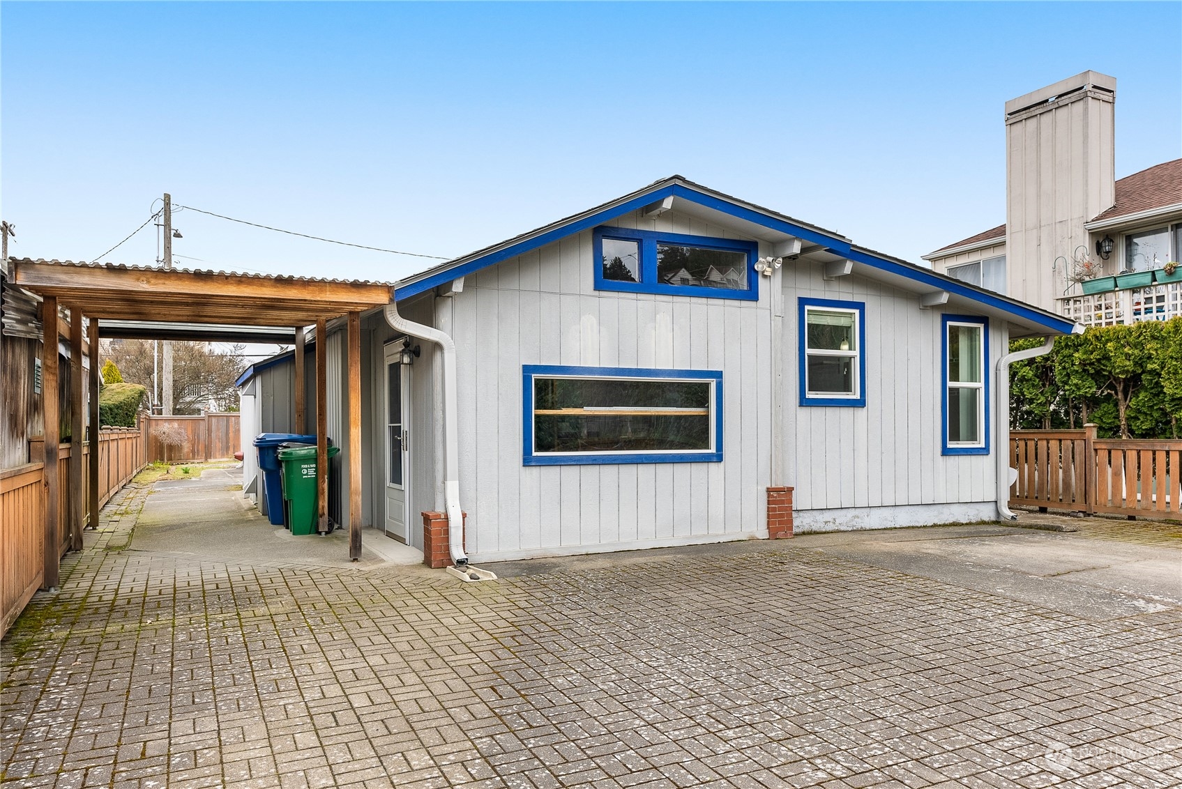 5915 Southwest Admiral Way Seattle, WA 98116 - Photo 25 of 31 a front view of a house with a yard