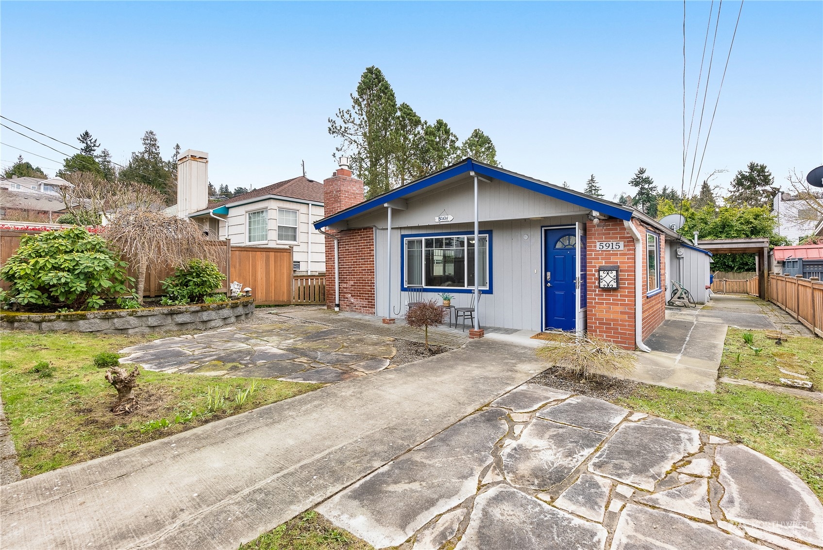 5915 Southwest Admiral Way Seattle, WA 98116 - Photo 4 of 31 a view of a house with a yard siting area and garden