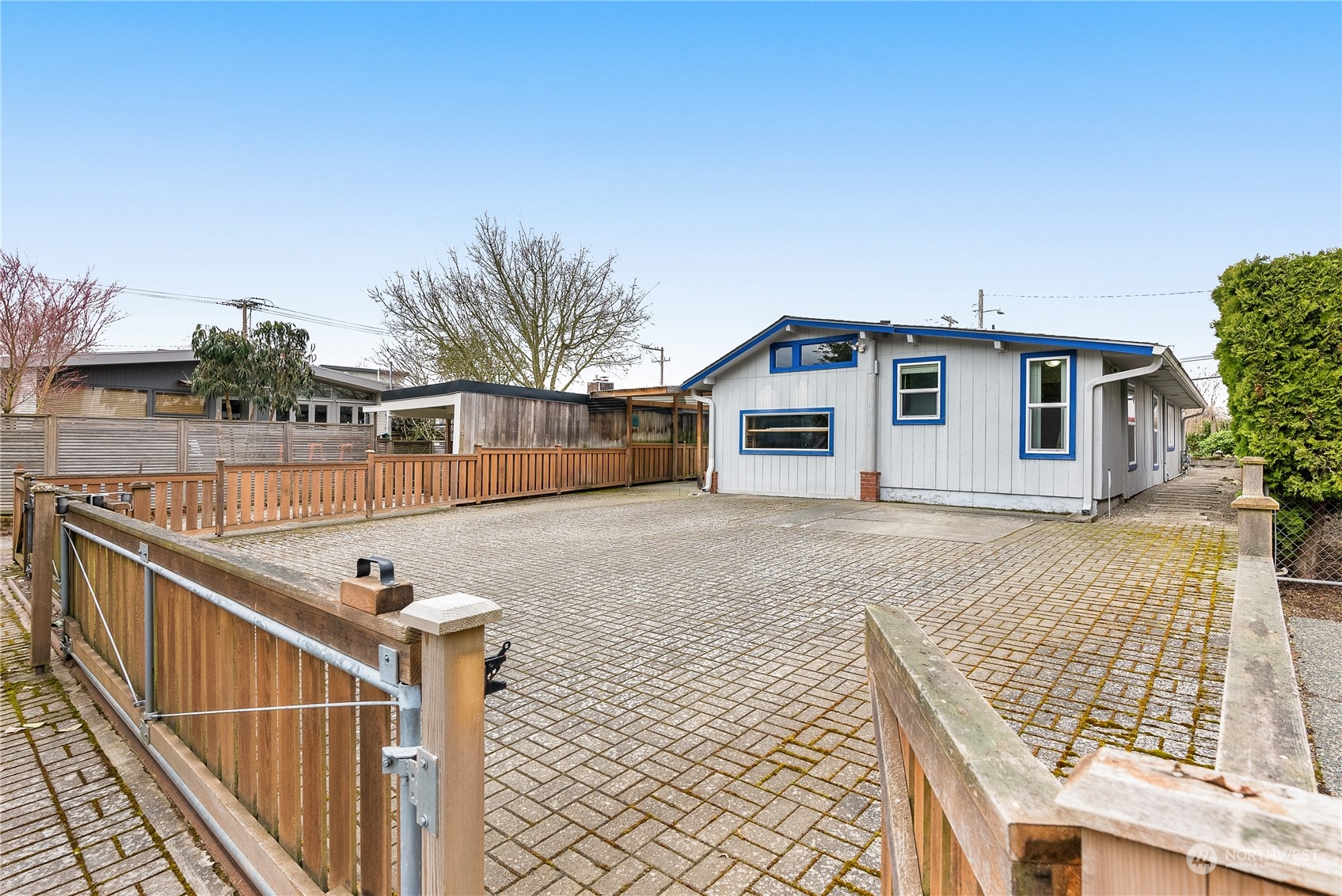 5915 Southwest Admiral Way Seattle, WA 98116 - Photo 5 of 31 a front view of a house with wooden fence