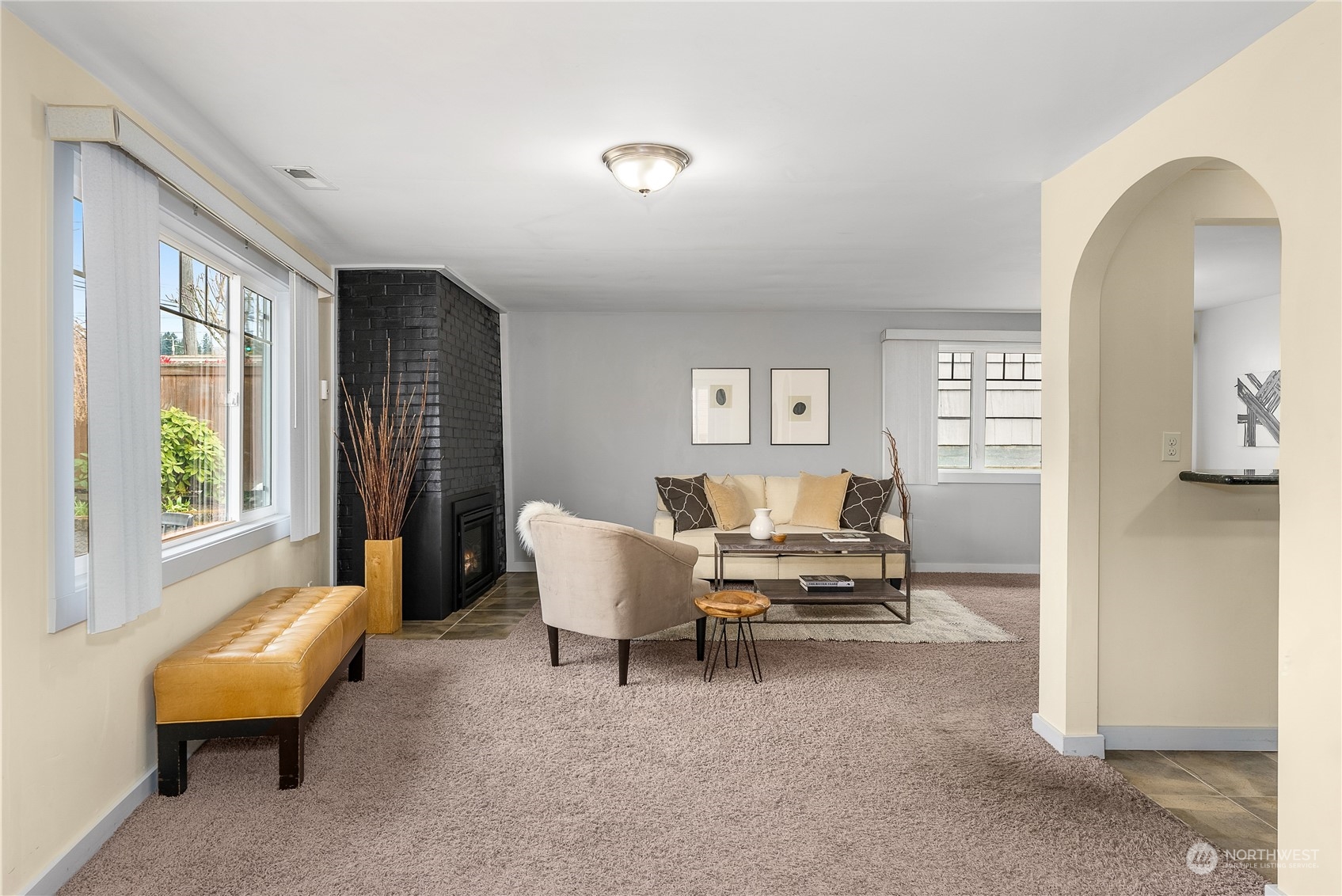 5915 Southwest Admiral Way Seattle, WA 98116 - Photo 7 of 31 a living room with furniture and a window