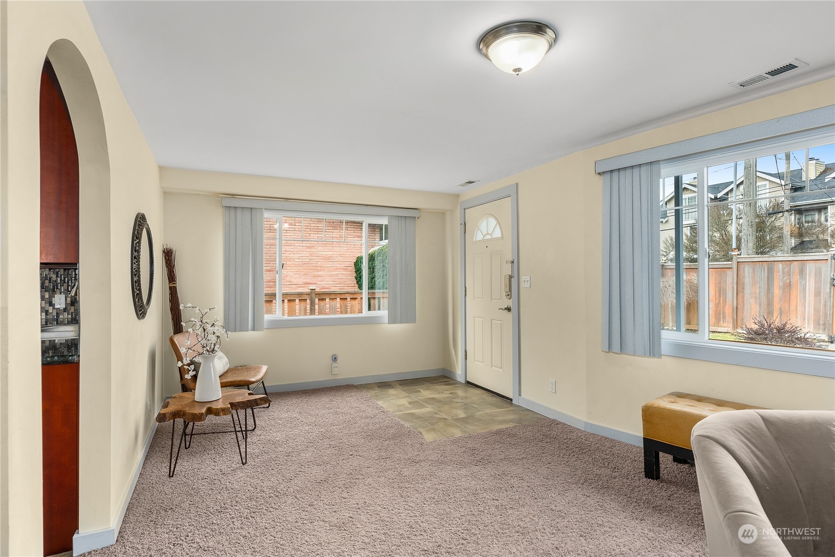 5915 Southwest Admiral Way Seattle, WA 98116 - Photo 8 of 31 a living room with furniture and a window