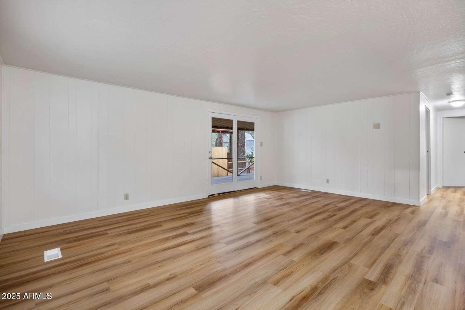 5369 North Blue Ridge Loop, Unit S Pinetop, AZ 85935 - Photo 8 of 33 a view of empty room with wooden floor and fan