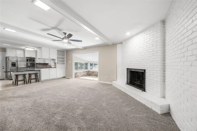 a kitchen with stainless steel appliances a refrigerator sink and cabinets