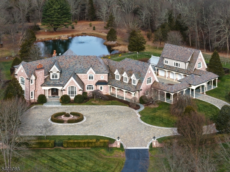 581 Pottersville Road Bedminster, NJ 07931 - Photo 2 of 50 an aerial view of a house with swimming pool