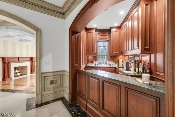 a kitchen with stainless steel appliances granite countertop a sink and cabinets