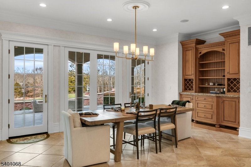 581 Pottersville Road Bedminster, NJ 07931 - Photo 28 of 50 a kitchen with a table chairs stove and cabinets