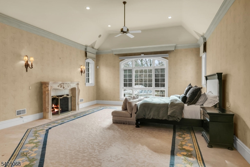 581 Pottersville Road Bedminster, NJ 07931 - Photo 32 of 50 a spacious bedroom with a bed and a fireplace