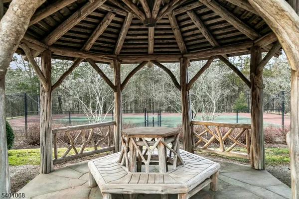 a front view of a house with a yard table and chairs
