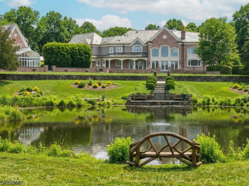 581 Pottersville Road Bedminster, NJ 07931 - Photo 44 of 50 a front view of a house with a yard