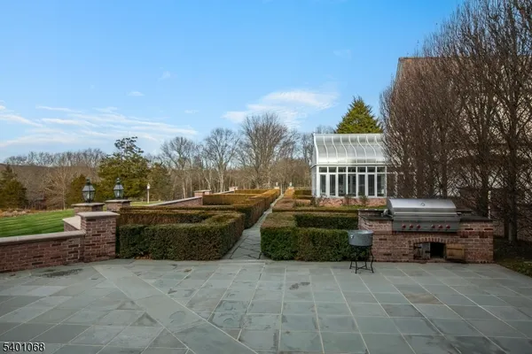 a view of a patio with couches and a fire pit