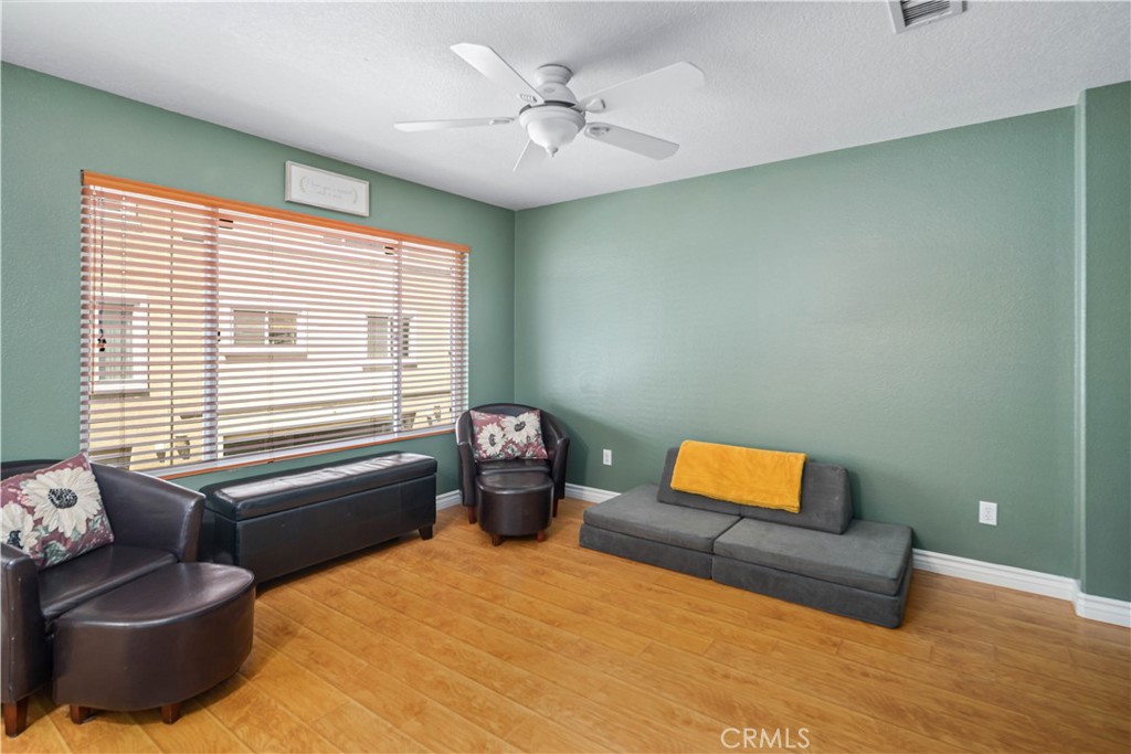 25710 Wagner Way, Unit C Stevenson Ranch, CA 91381 - Photo 11 of 37 a bedroom with a bed and a couch