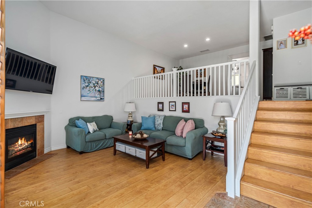 25710 Wagner Way, Unit C Stevenson Ranch, CA 91381 - Photo 15 of 37 a living room with furniture and a fireplace