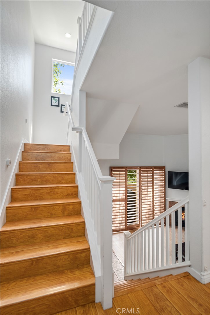 25710 Wagner Way, Unit C Stevenson Ranch, CA 91381 - Photo 18 of 37 a view of entryway and hall with wooden floor