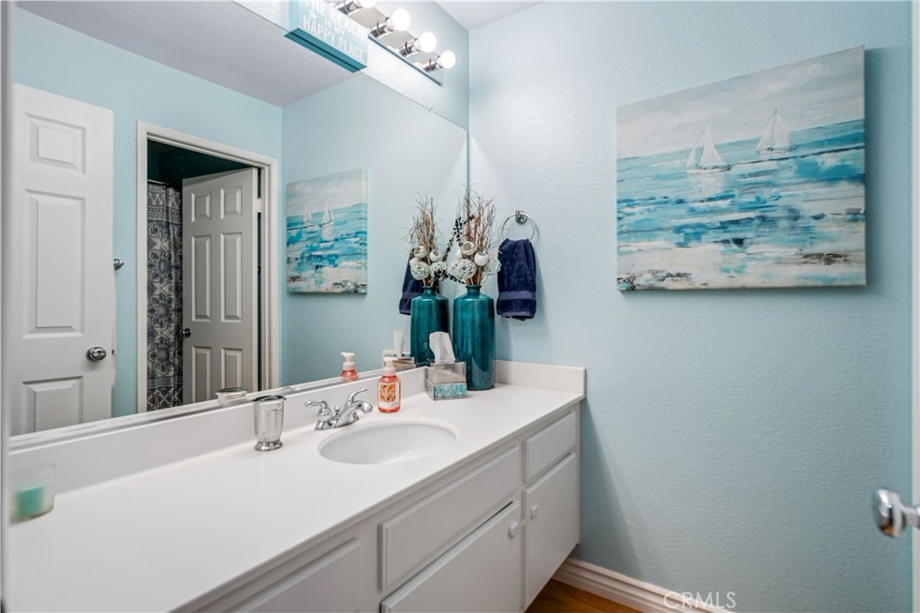 25710 Wagner Way, Unit C Stevenson Ranch, CA 91381 - Photo 27 of 37 a bathroom with a sink double vanity and a mirror