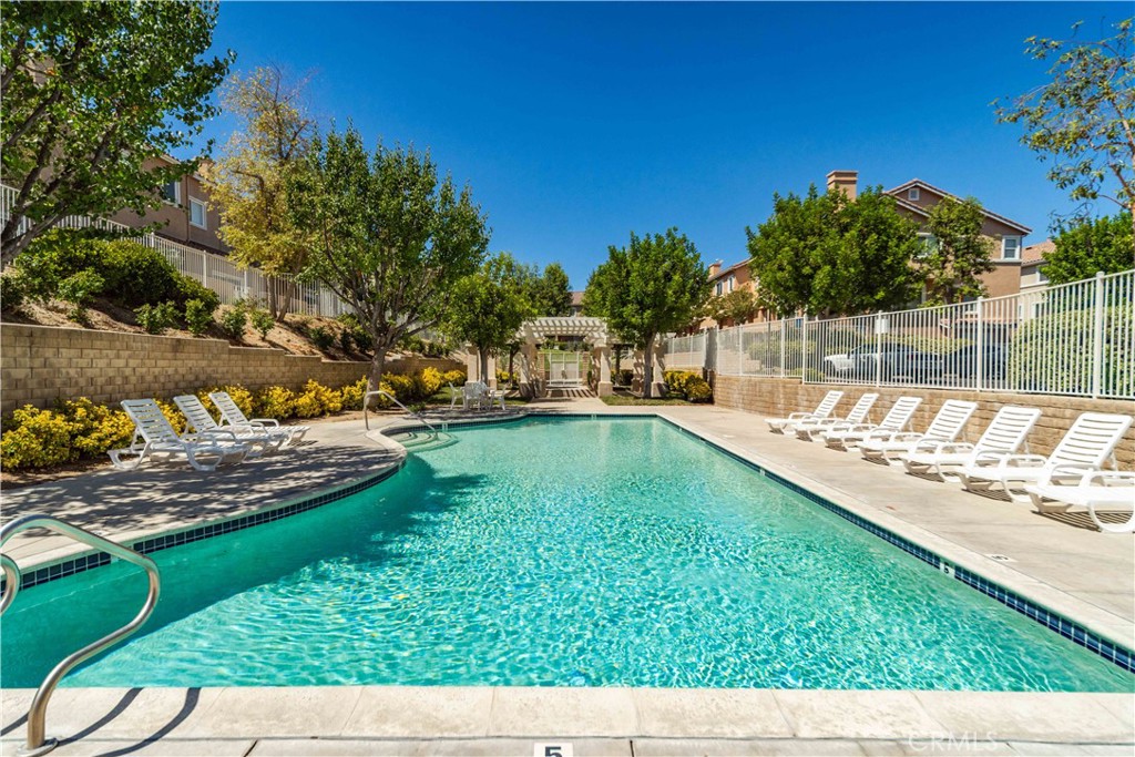 25710 Wagner Way, Unit C Stevenson Ranch, CA 91381 - Photo 34 of 37 a view of a backyard with swimming pool