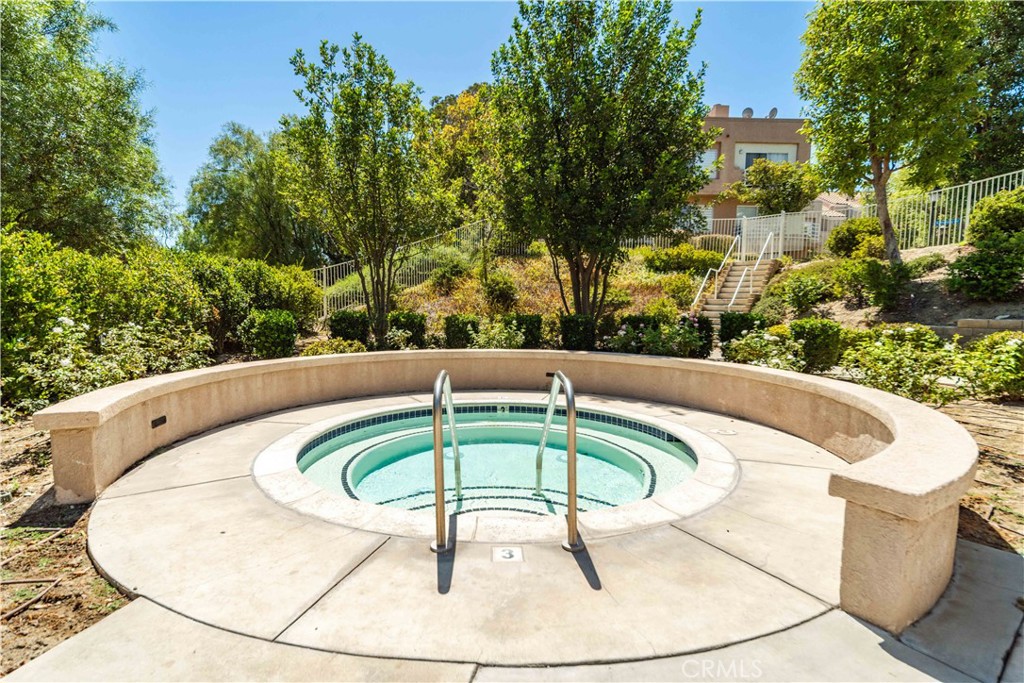 25710 Wagner Way, Unit C Stevenson Ranch, CA 91381 - Photo 36 of 37 a view of a swimming pool with a outdoor seating