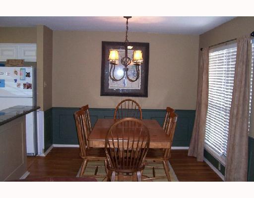 7005 Ridge Stone Drive Corpus Christi, TX 78413 - Photo 4 of 8 a view of a dining room with furniture and chandelier