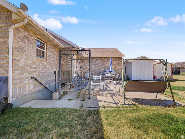598 West 1600th Street North Mapleton, UT 84664 - Photo 24 of 34 View of patio featuring a shed