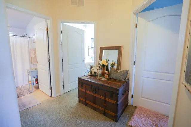 a room with a bed and a mirror