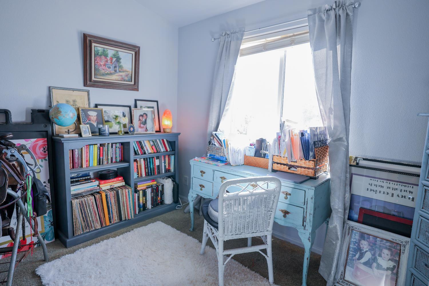124 Wyer Road Arbuckle, CA 95912 - Photo 23 of 43 a view of a workspace with furniture and a book shelf