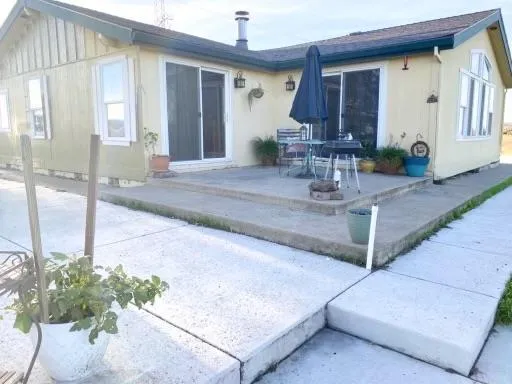 a house view with a outdoor space