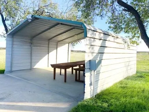 a view of a yard with an outdoor space
