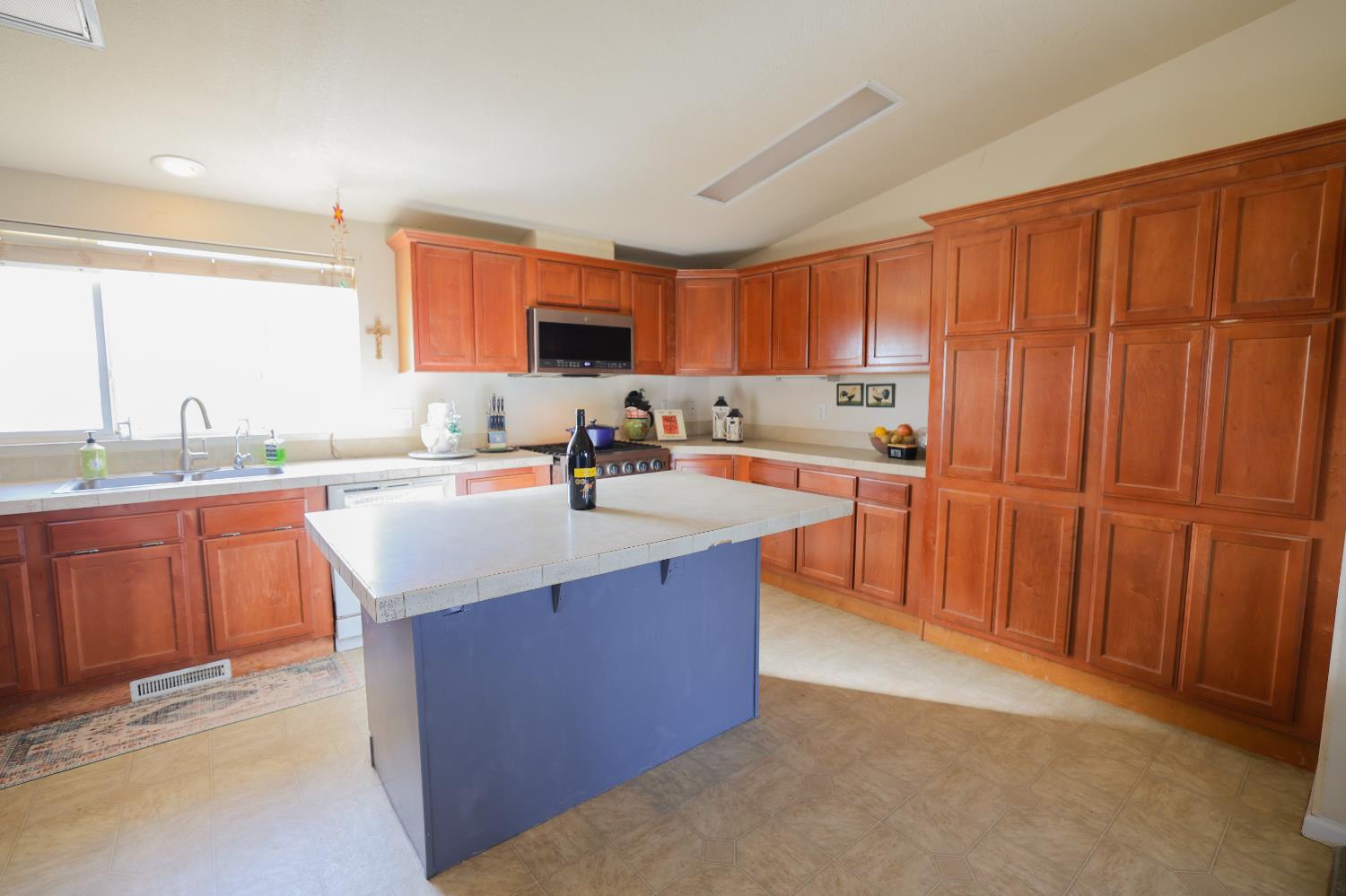 124 Wyer Road Arbuckle, CA 95912 - Photo 3 of 43 a kitchen with stainless steel appliances granite countertop a sink counter space and a window